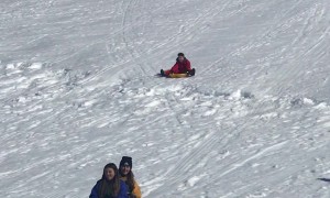 Sledder Collides With Barrier