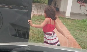 Independent Daughter Uses Whole Body To Open Gate