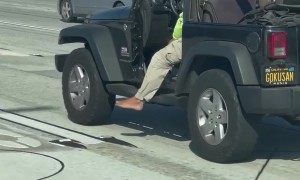 Driver Lets His Foot Hang Loose on the Highway