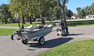 Man Pulls Boat With a Motorized Chair