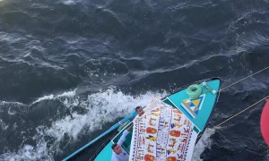 Boat Merchants Sell Wares To Tourist Cruise