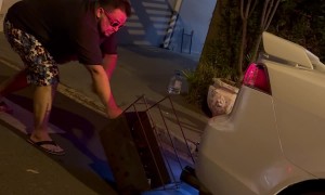 Man Lights Barbeque Using Car Exhaust