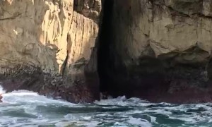 Paddleboarder Risks Rocky Crevice