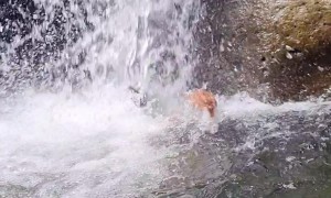 Waterfall Submerges Unsuspecting Swimmer