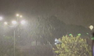 Lovers Kiss In Pouring Rain