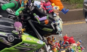 Man's Motorbike Covered In Toys