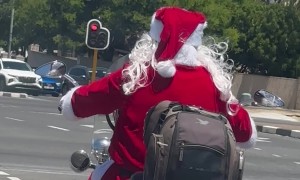 Santa Rides a Motorcycle Through Cape Town