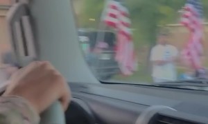 Neighbors Welcome Home Soldier With Street Of Flags
