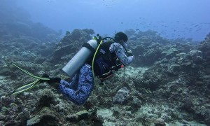 Bored Scuba Diver Plays With Plastic Bottle