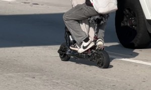 Sharing A Scooter On The Highway