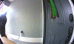 Delivery Man Smacks Head On Hanging Christmas Bells