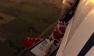 Aerobatic Plane Covered In Christmas Lights
