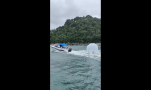 Boaters Rescue Boy Floating In Inflatable Plastic Bubble