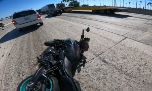 Lane Splitting Motorcyclist Hit By Sudden Merger
