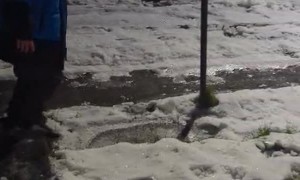 Son Somersaults Safely Down Icy Slope