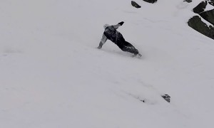 Snowboarder Takes A Few Tumbles