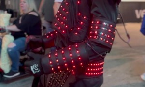 Man Dances in Light-Up Robot Costume