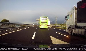 Bus Pins Car Against Median