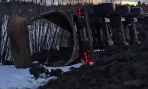 Truck Tips Over While Backing Up In Snow