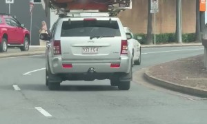 Hot Tub Strapped to Car on Freeway