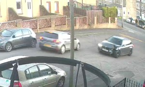 Driver Speeds Around Corner and Collides With Streetlight