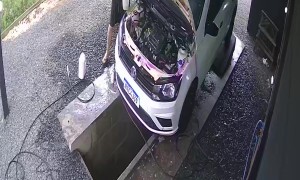 Car Washer Steps Into Water Chute