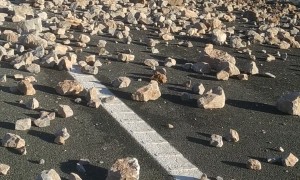 Cleaning Up After Truck Loaded With Stones Overturned