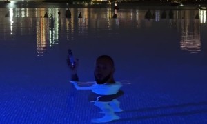 Optical Illusion Hilariously Shrinks Swimming Man