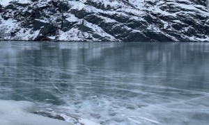 Glacier Breaks Onto Frozen Lake