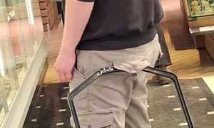 Man Hooks Grocery Basket Onto Pants