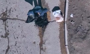 Man Fixes Pothole In Road