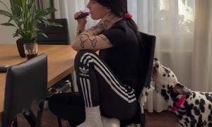 Woman Unbothered by Dog Biting Chair