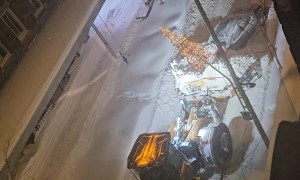 Car Gets Special Ride From Snow Remover