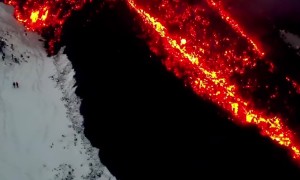 Snowboarding Next to Flowing Lava