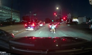 Two Women's Physical Altercation Spills Into Street Traffic