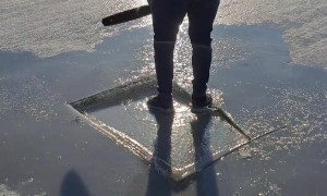 Ice Breaks Around Chainsaw