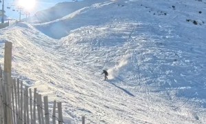 Snowboarder Crashes Over Fence