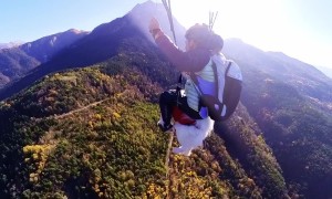 Man And Samoyed Paraglide Over French Alps