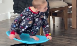 Child Whirls Around On Spin Chair