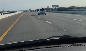 Passenger Rides Atop Speeding SUV