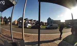 Distracted Man Walks Face-First Into Metal Pole