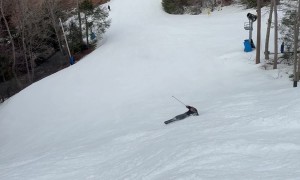 Skiing Father Still Sliding Down Slope