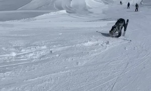 Skier Recovers From Backward Tumble