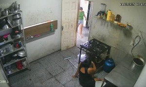 Woman Slips and Falls While Mopping Kitchen