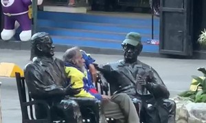 Man Hangs Out With Statues Of Nazoa Brothers