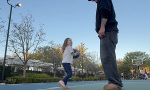 Dad Blocks Daughter's Theme Park Basketball Shot