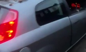 Car Waits For Mate Under Fallen Brick Pile