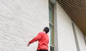 Soccer Player Kicks Ball Into Rafters