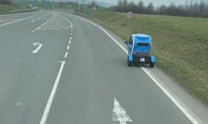 Tiny Vehicle Drives Along Czech Roadway