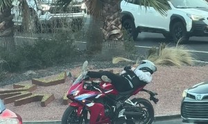 Motorcyclist Relaxes at Stoplight